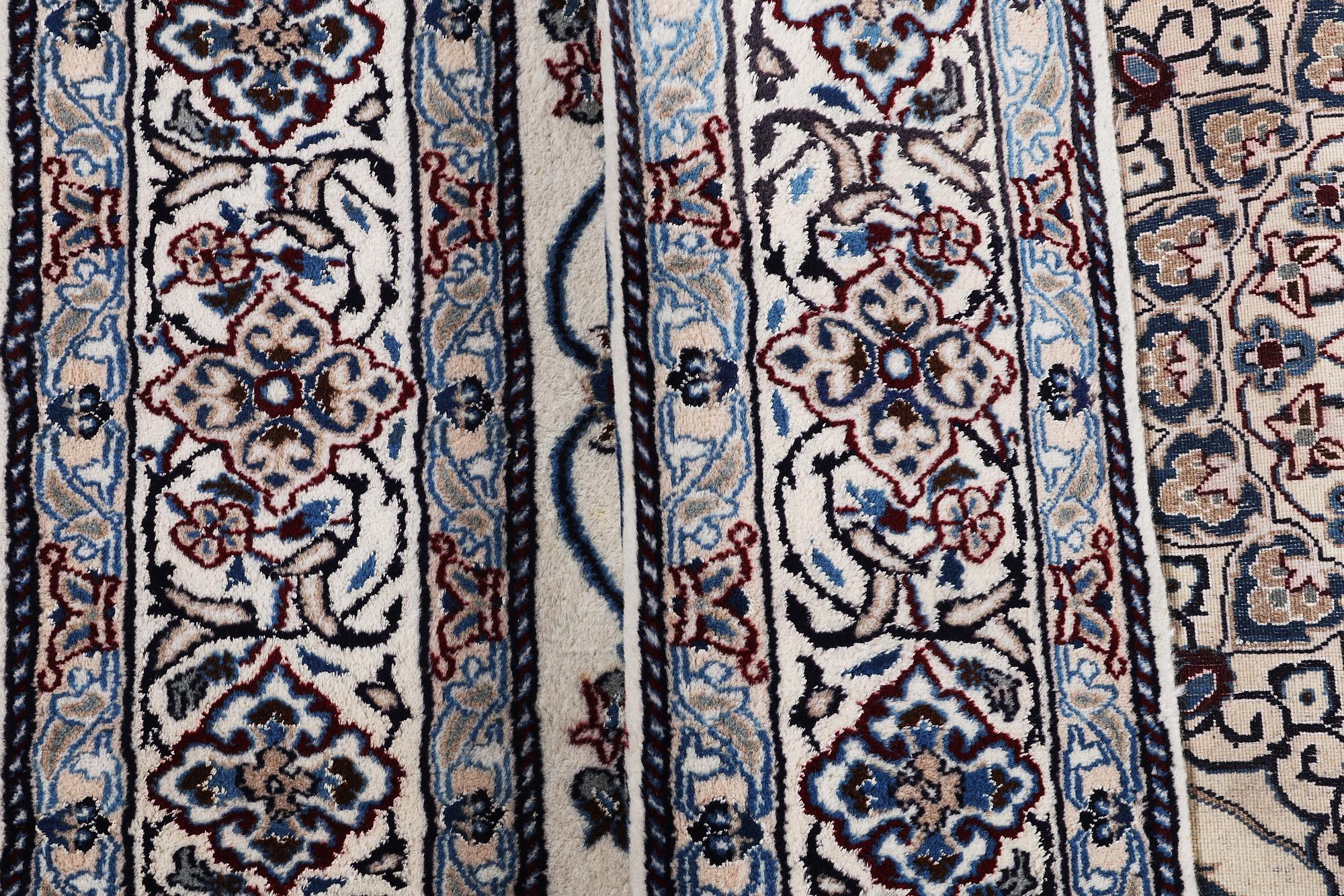 A carpet, Nain, part silk, 9 laa, ca 290 x 196 cm.