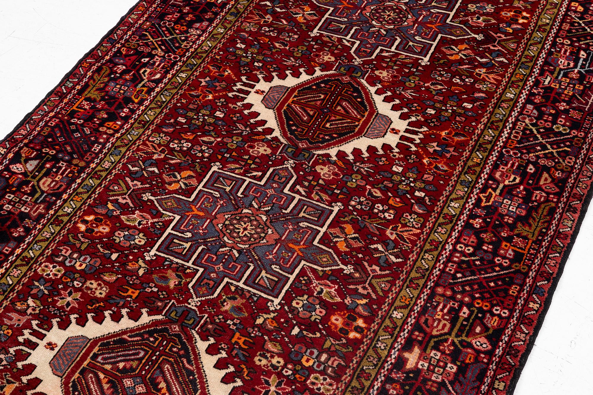 A semi-antique Karadja runner, c. 405 x 155 cm.