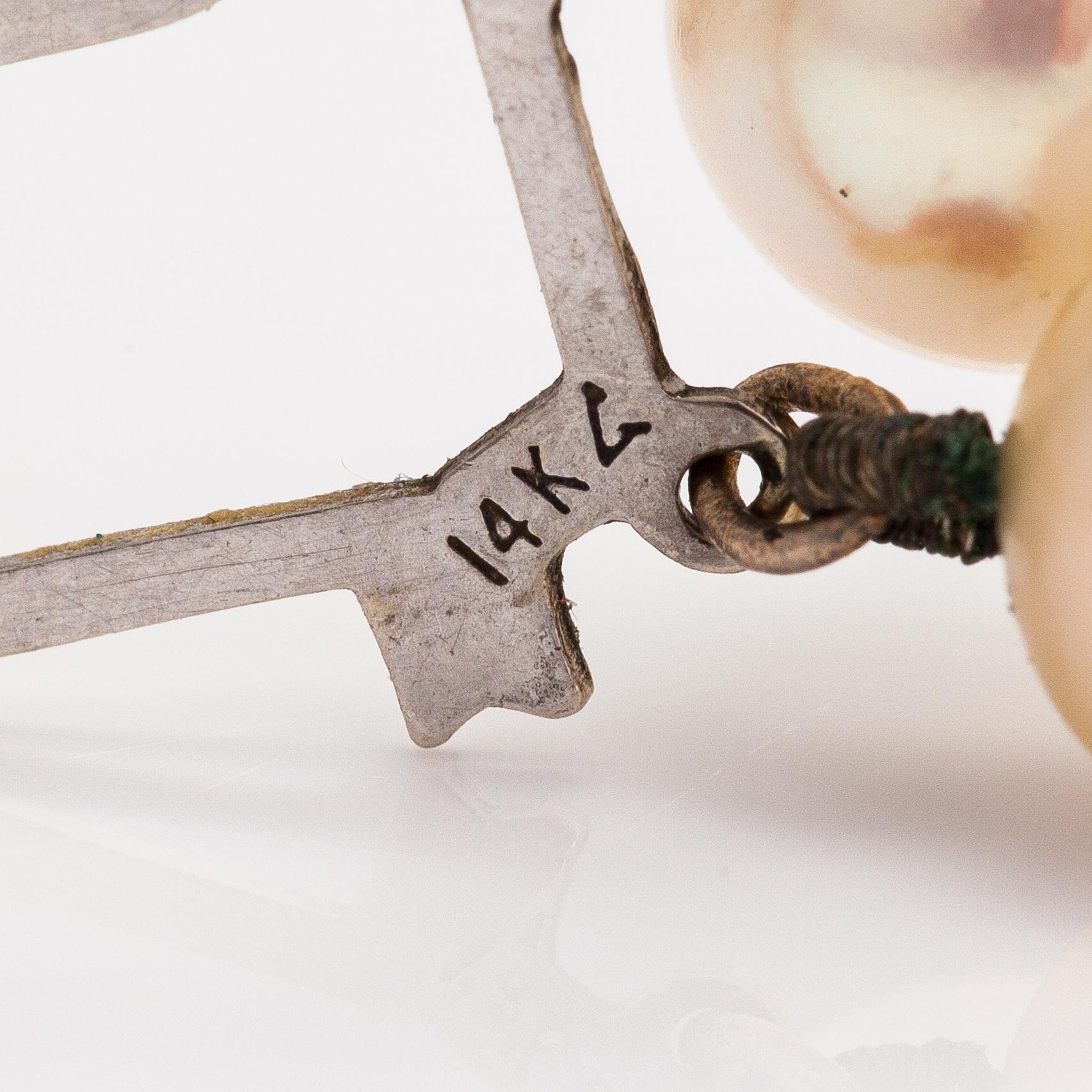 A 2-strand pearl collier with cultured pearls and a 14K white gold clasp.