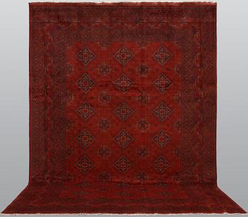 An Afghan carpet, 343 x 243 cm.