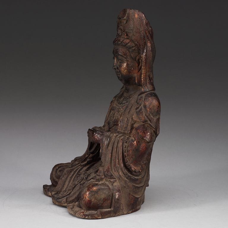 A cast iron figure of a seated Guanyin, presumably late Ming dynasty.