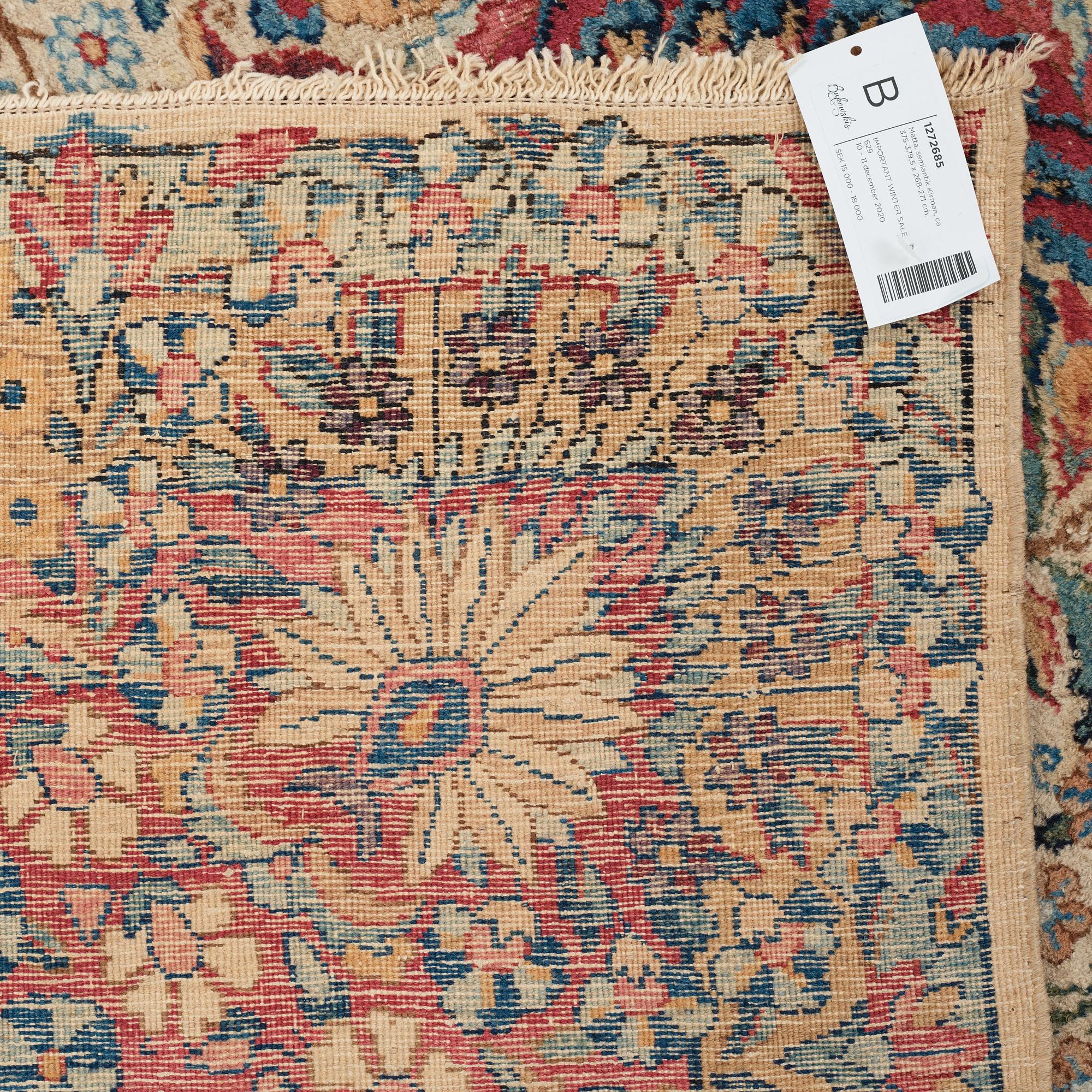 A carpet, a semi-antique Kerman, ca 375-379,5 x 268-271 cm.