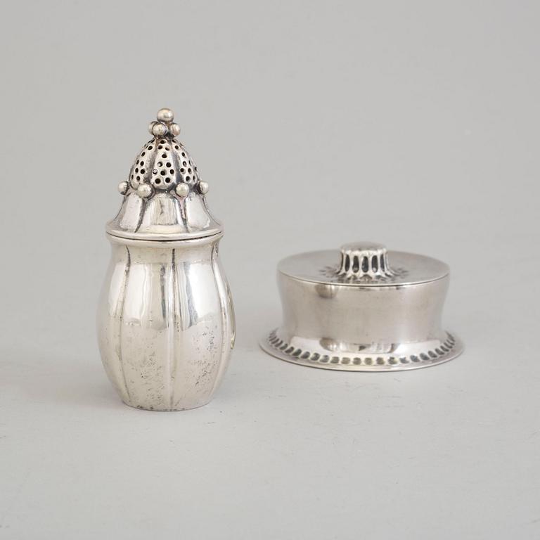 A Swedish Art Nouveau parcel-gilt lidded box and silver pepper shaker, mark's Anders Nilsson, Lund 1913 and 1922.