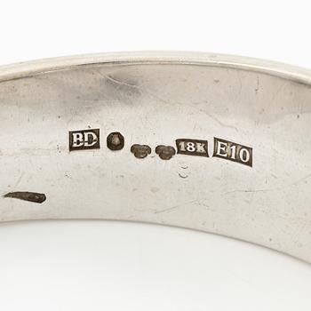Aftonklocka/armring, Bo Dolk, 18K vitguld med briljantslipade diamanter, 1970-tal.