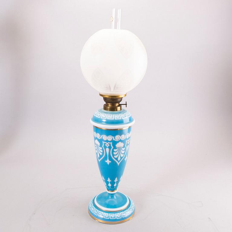 A glass paraffin lamp around 1900.