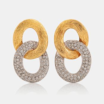 993. A pair of 18K gold and white gold Meister earrings set with round brilliant-cut diamonds.