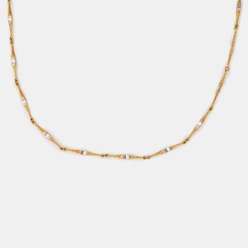 1068. A Lapponia necklace in 18K gold and platinum.