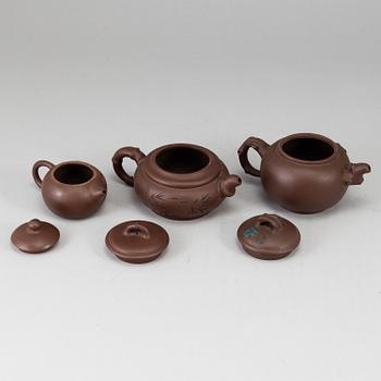 A group of three yixing pots, 20th century.