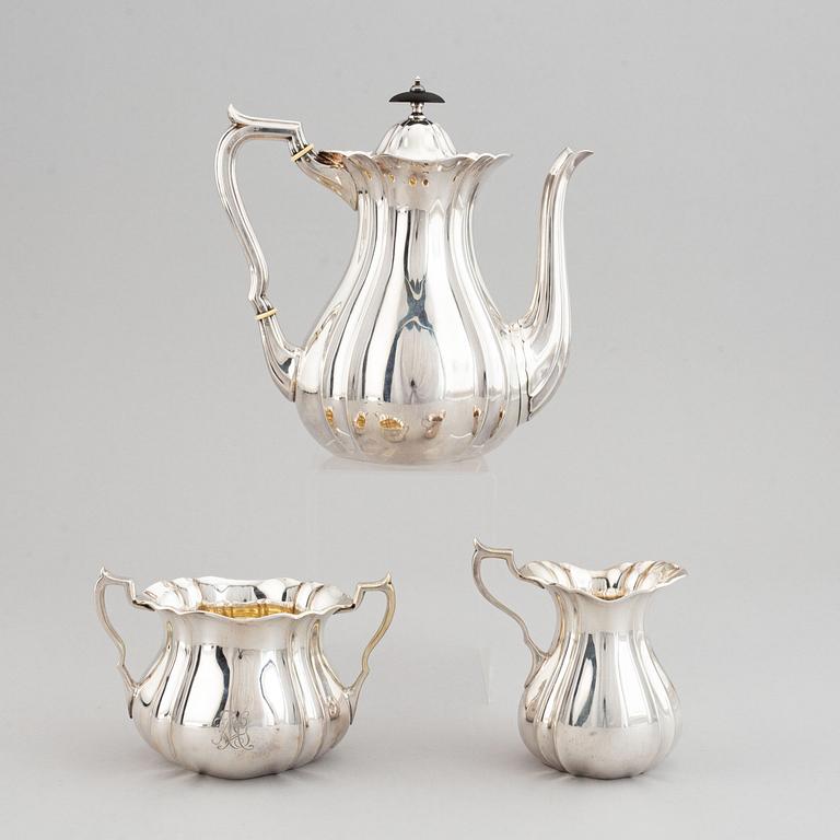 A swedish parcel-gilt coffee pot, creamer and suga bowl.