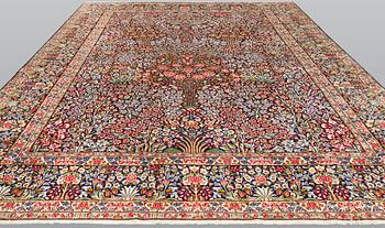 A Kirman Laver carpet, 'Millefleur', approx. 400 x 295 cm.