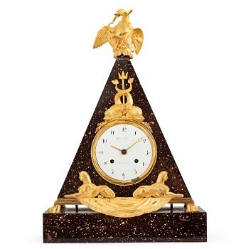 700. A late Gustavian early 19th Century porphyry and gilt bronze mantel clock.