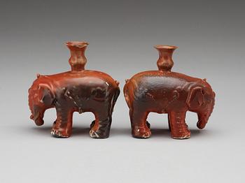 A matched pair of elephant candle holders, Qing dynasty.