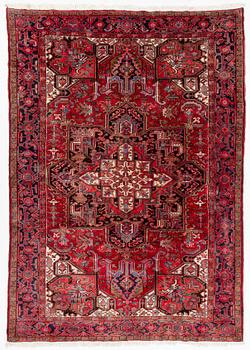 A Heris carpet, c. 345 x 245 cm.