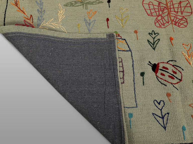 A hand-embroidered Kilim rug, approx. 241 x 183 cm.