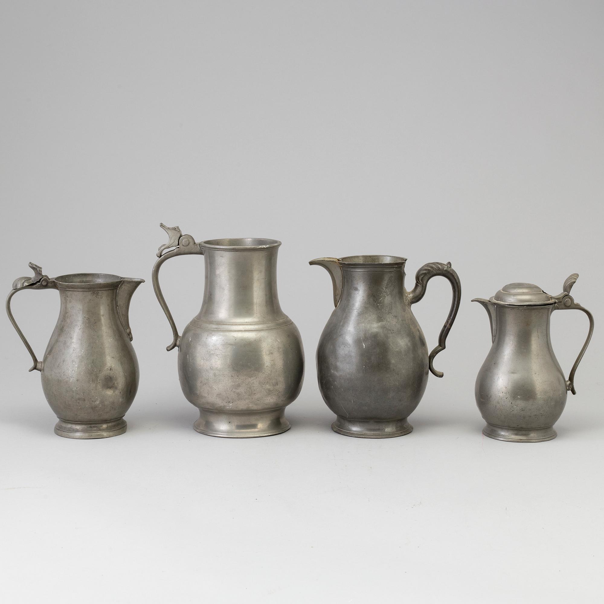 Four 18th century pewter jugs.