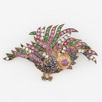 Brooch in the form of a bird, 14K gold with rubies, diamonds, sapphires, and emeralds.