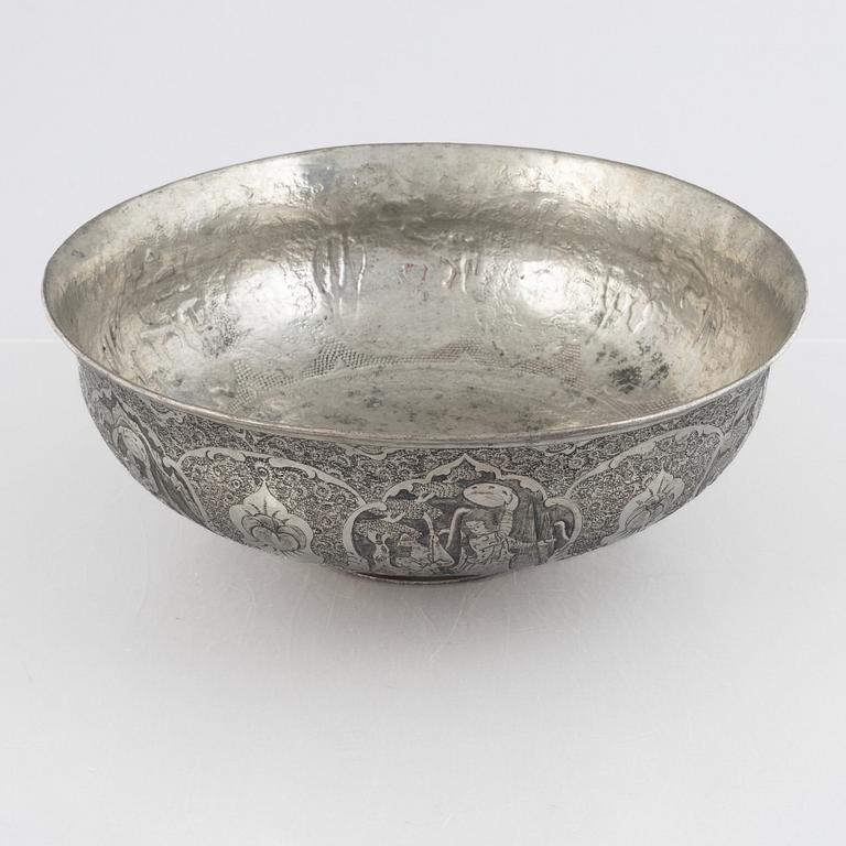A west Asian repoussé silver and copper vessle, circa 1900.
