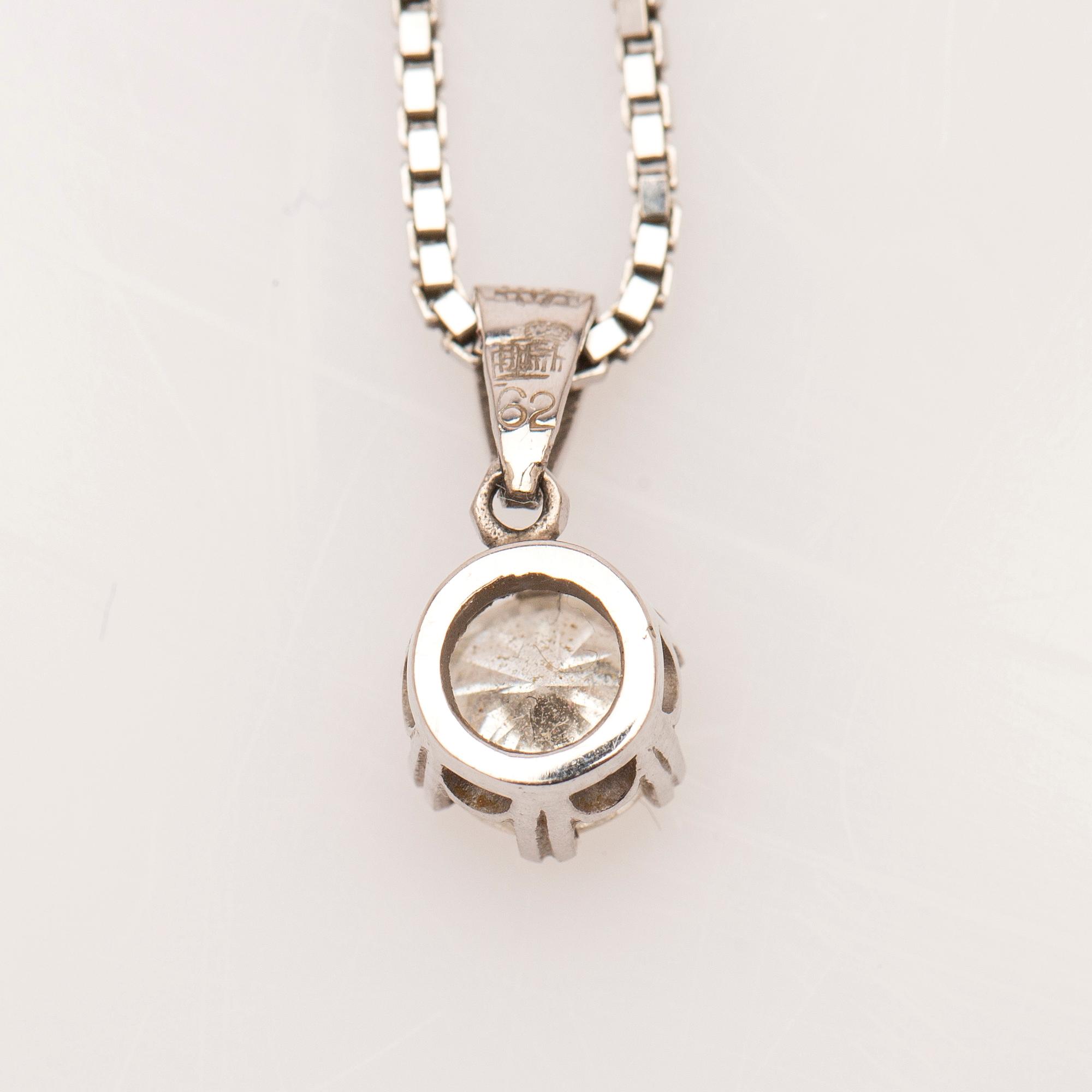 Collier med hänge, 18K vitguld med briljantslipad diamant.