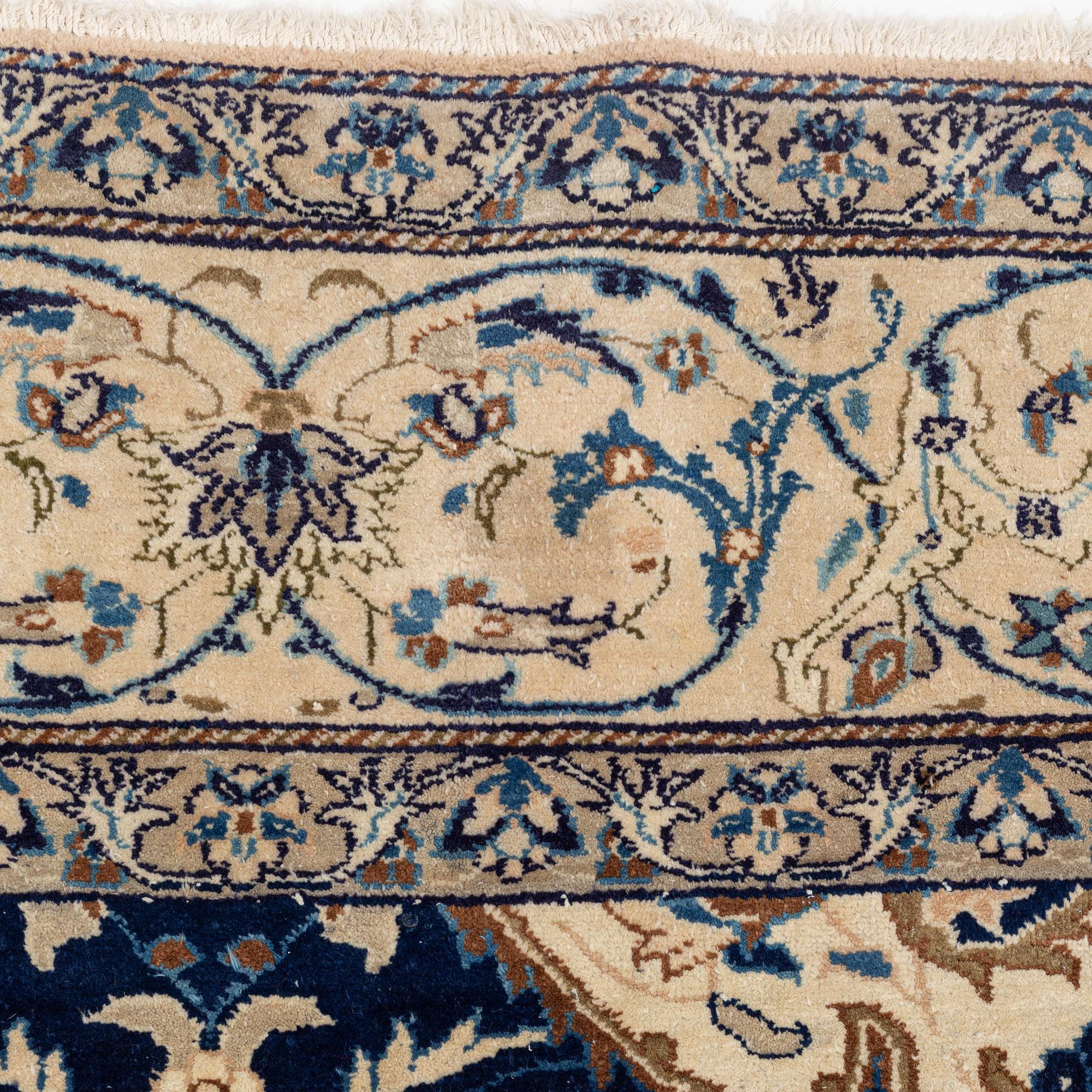 A carpet, possibly Yasd, c. 459 x 309 cm.