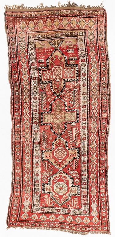 An oriental semi antique carpet, circa 272 x 120 cm.