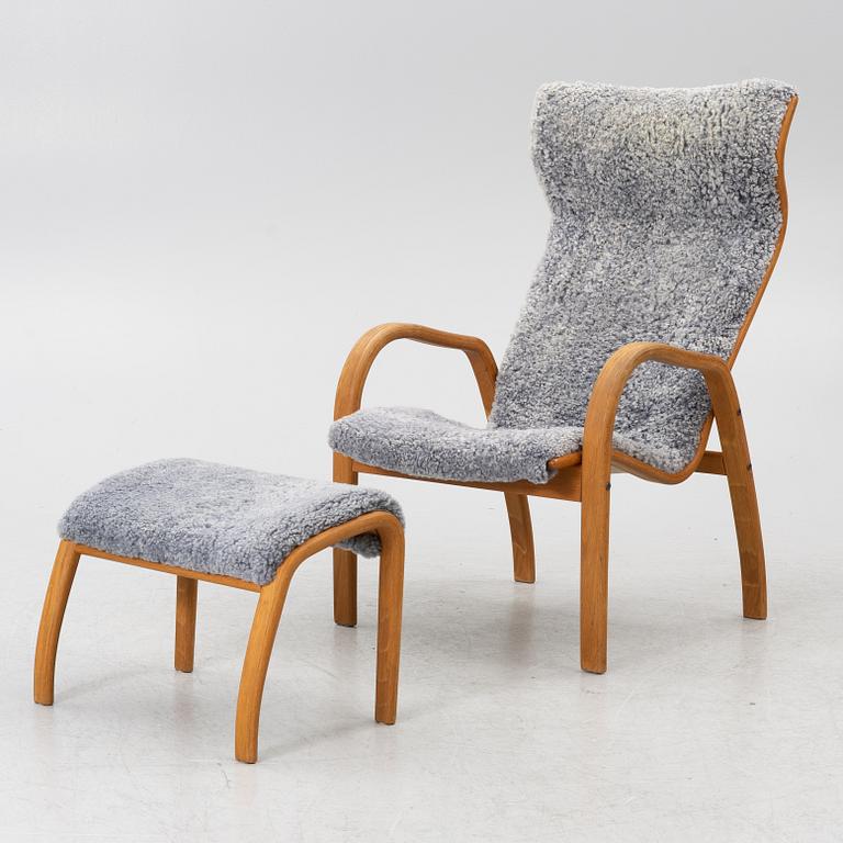 Jan Ekström, armchair with footstool "Gazelle", Conform, 21st century.