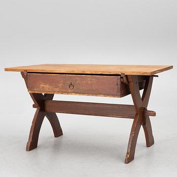 A Swedish folk-art trestle table from Dalarna, dated 1854.