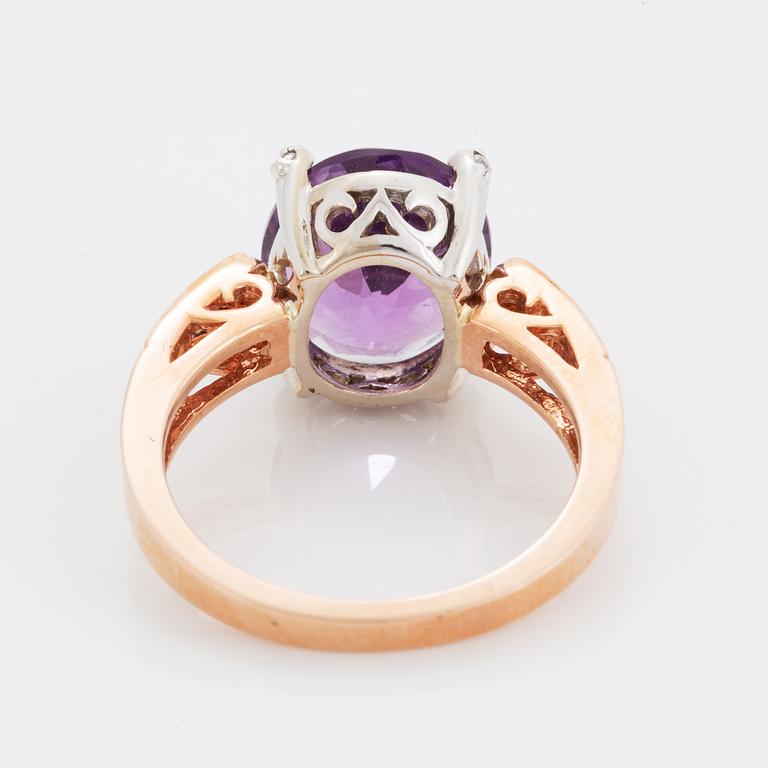 Oval faceted amethyst and brilliant-cut diamond ring.