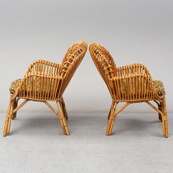 A pair of rattan armchairs, Emilio Paoli, via Vigna Nuova, 8, Firenze, Italy, second half of the 20th century. Signed.