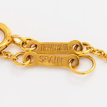 Tiffany & Co, Elsa Peretti, an 18K gold 'Open Heart' necklace.