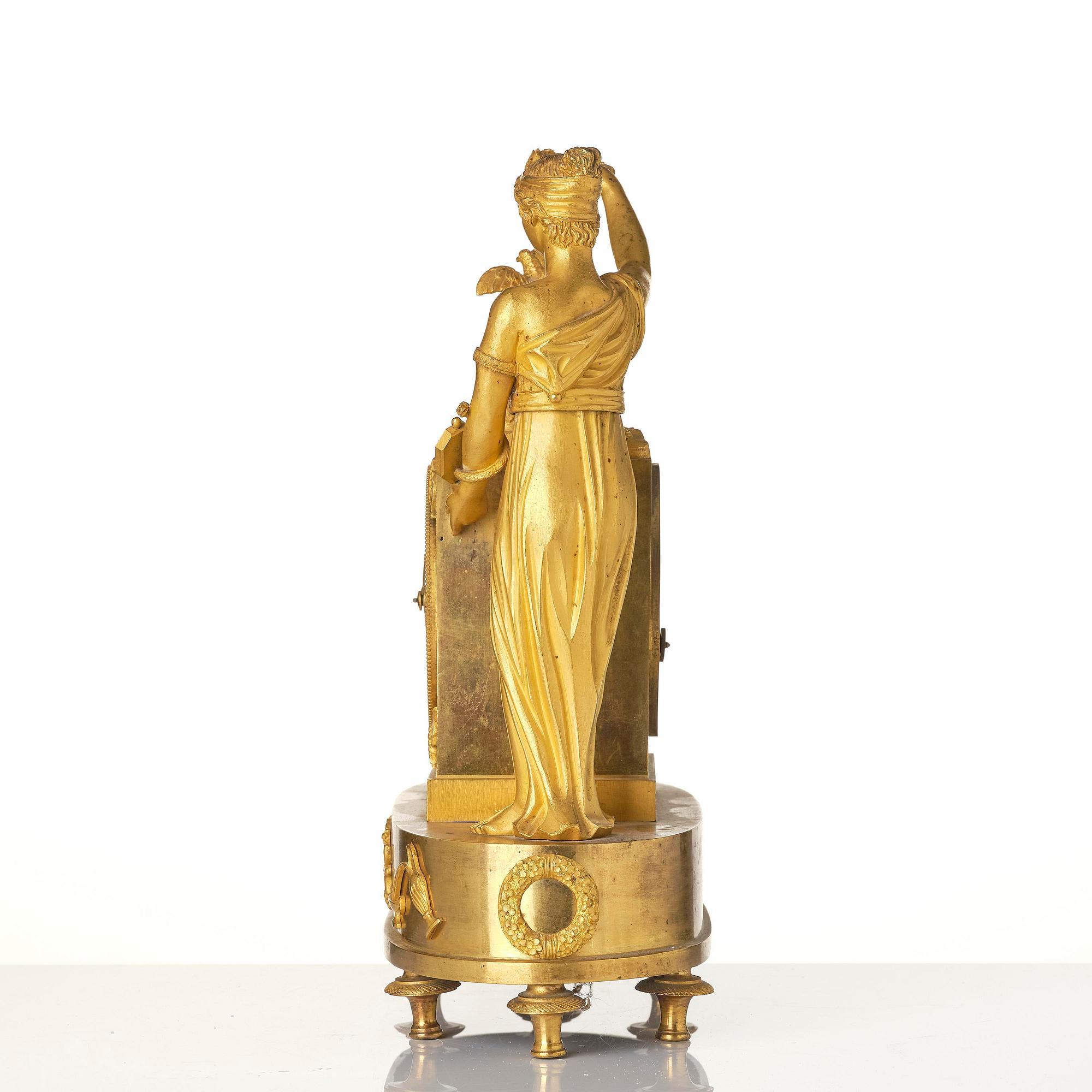 A French Empire figural mantel clock, early 19th century.