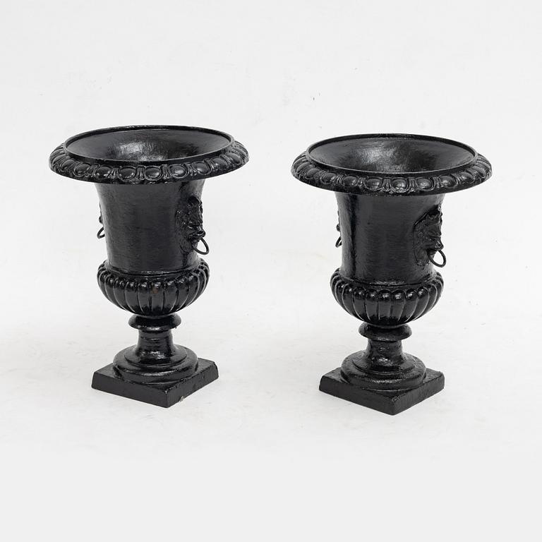 Garden urns, a pair, cast iron, 20th century.