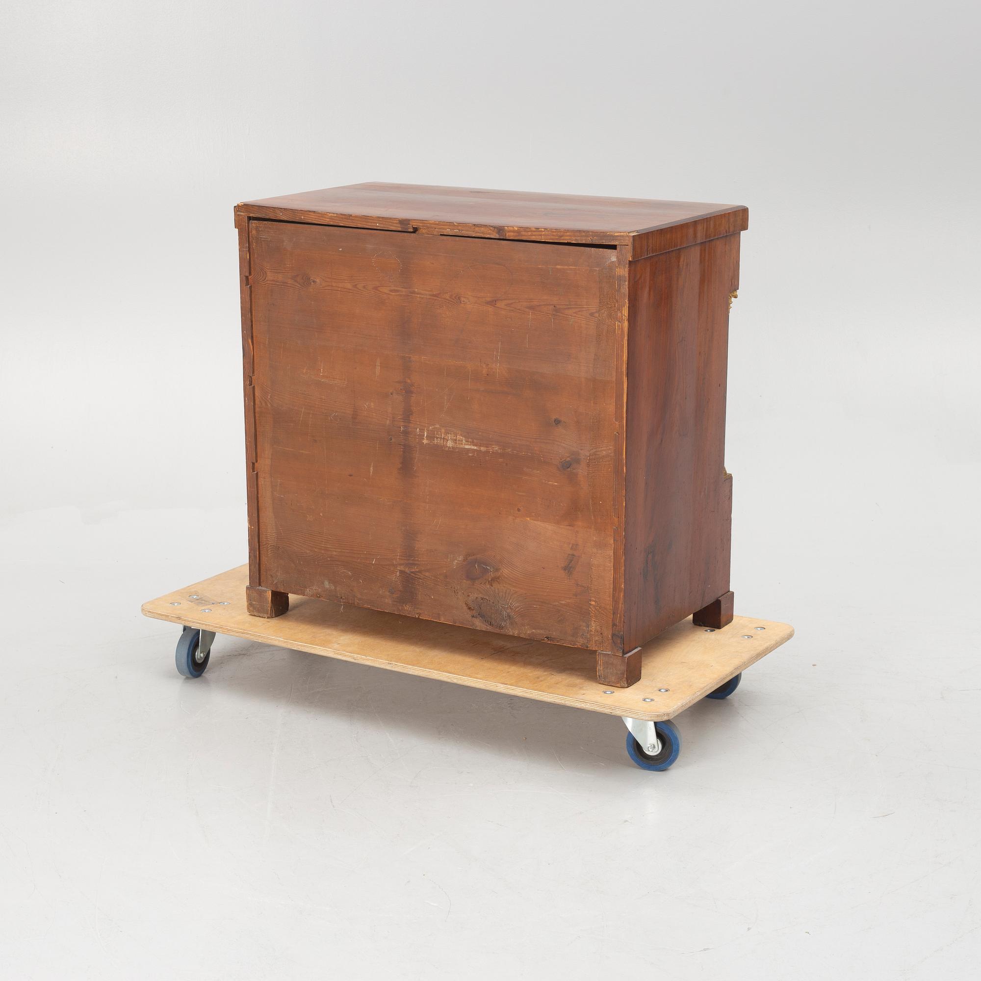 An Empire chest of drawers, first half of the/mid 19th century.