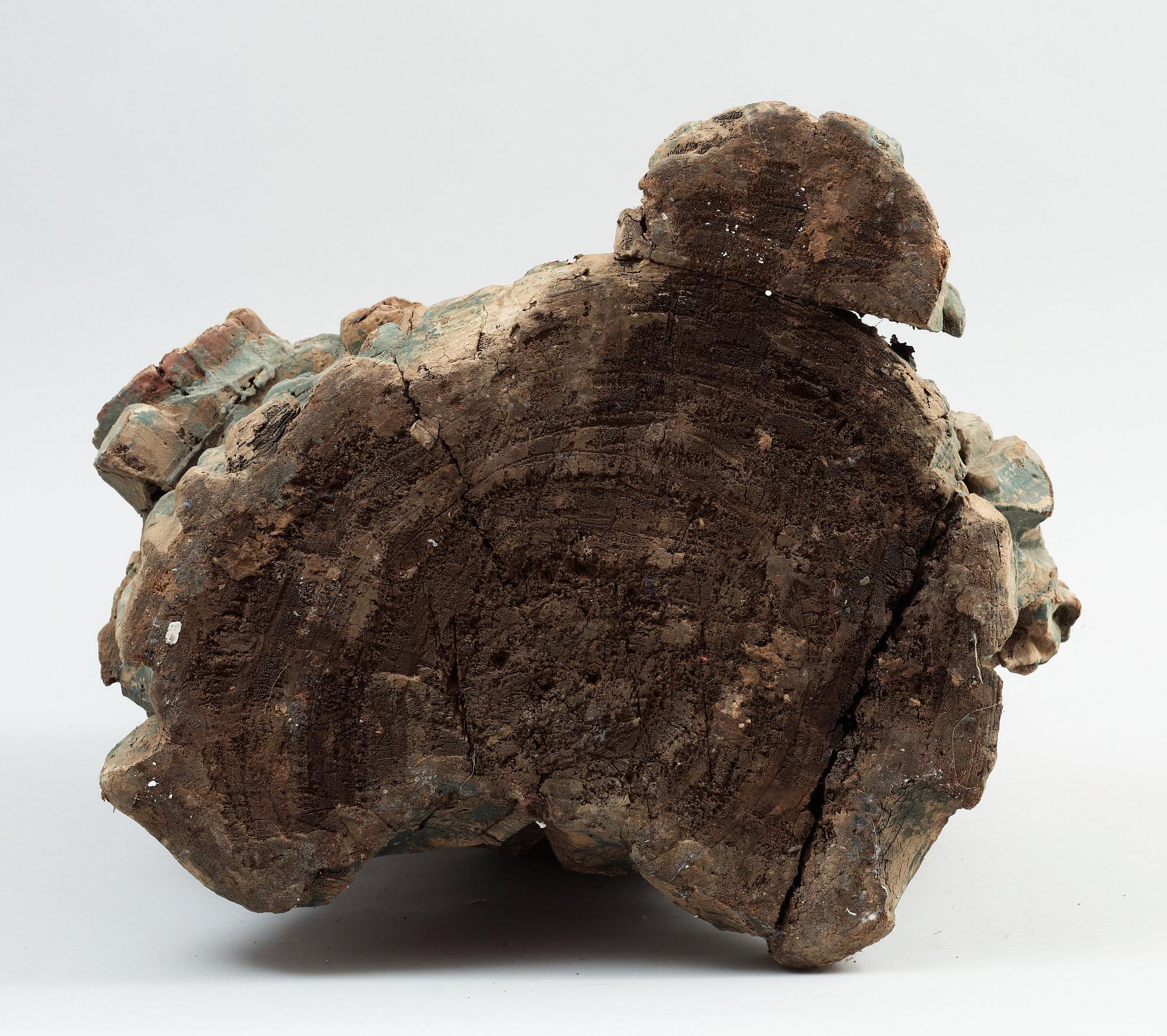 A seated wooden figure of Guanyin, presumably Ming dynasty (1368-1644).