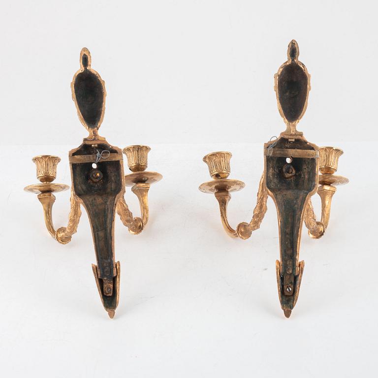 A pair of Russian Louis XVI gilt-bronze two-branch wall lights, late 18th century.