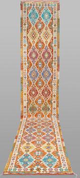 A Kilim runner, classic design, approximately 771 x 127 cm.