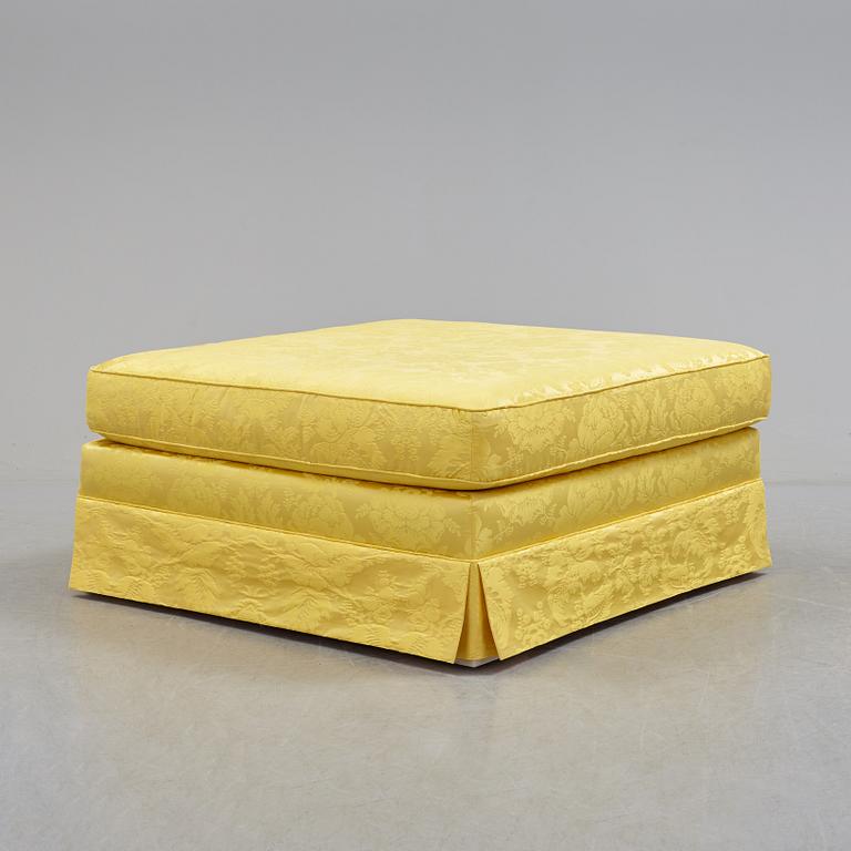 a stool upholstered with silk damask from Vera Seta.