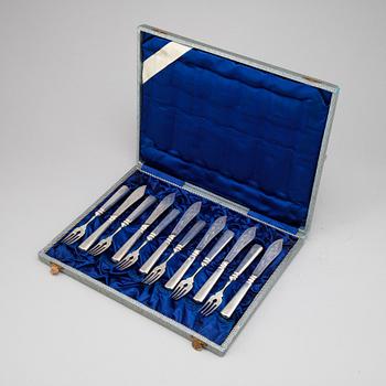 A set of twelve Hungarian early 20th century silver 800/1000 fish-cutlery.