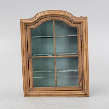 A 19th century wall hanged cabinet.