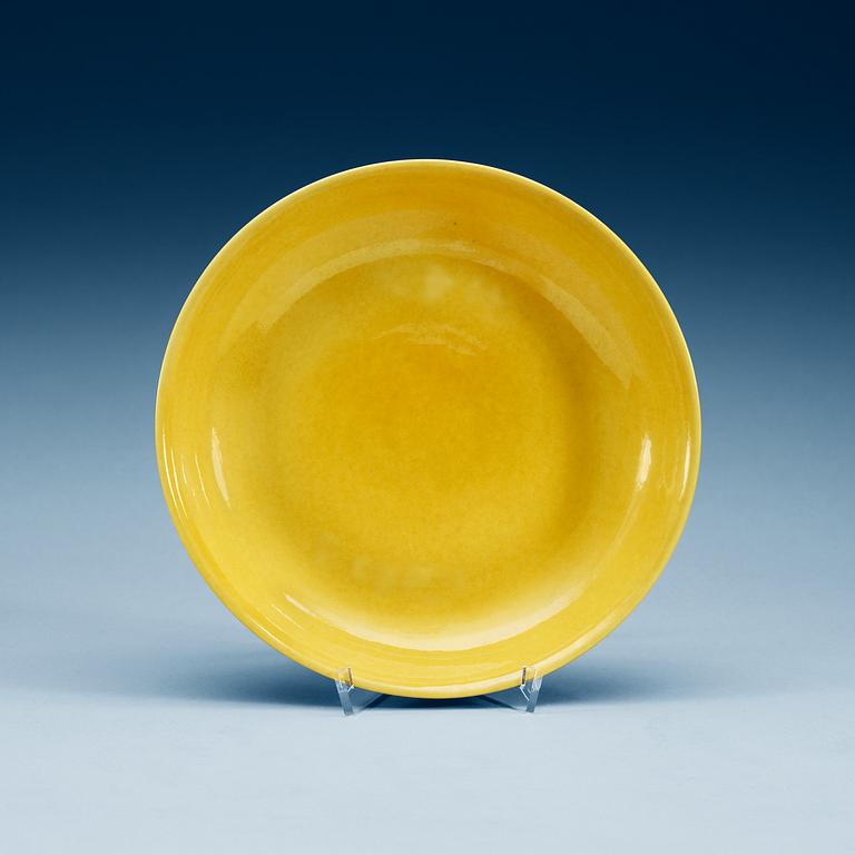 A yellow glazed dish, Ming dynasty, with Zhengdes six character mark and of the period (1506-21).