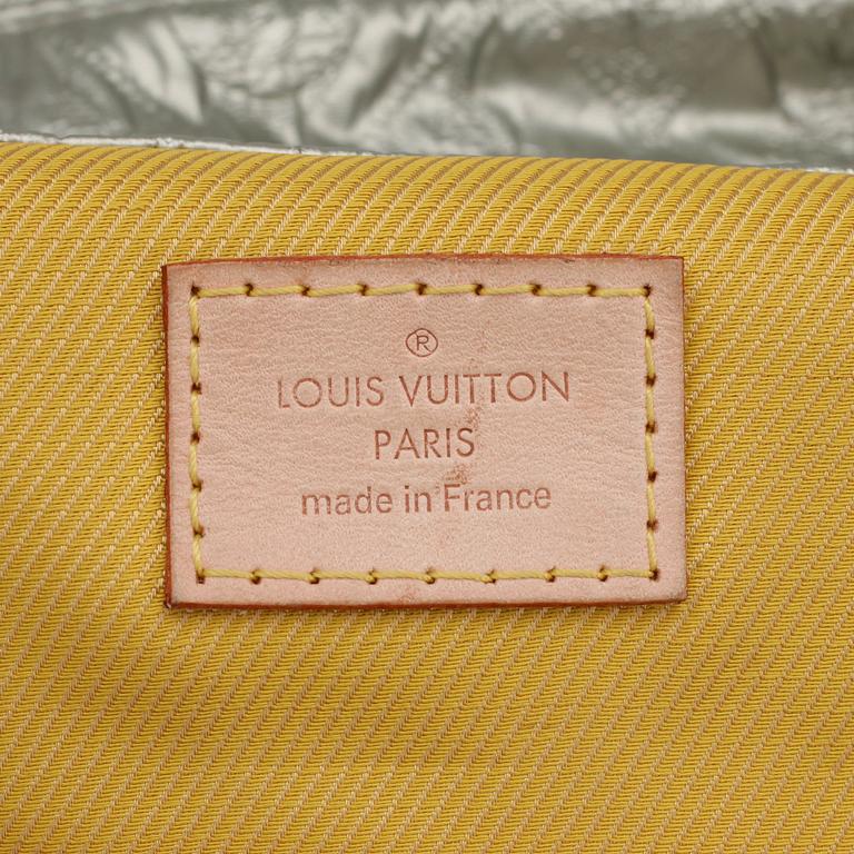 LOUIS VUITTON, a monogram silver colored clutch.