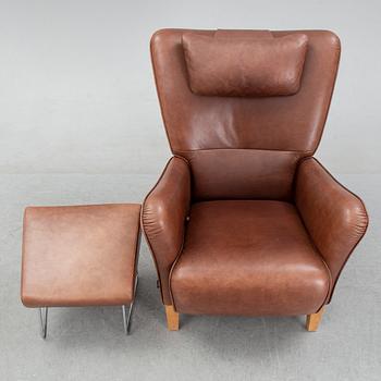 A 'Stepp' easy chair width stool by Carl-Henric Spak for Swedese.