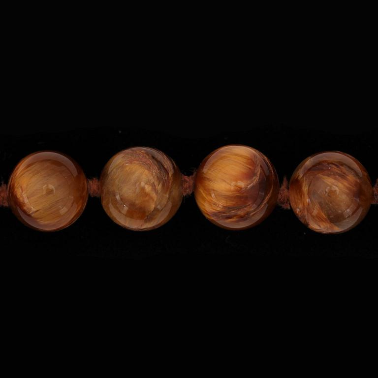 A Tiffany & Co Angela Cummings necklace with tigers eye quartz and gold clasp.