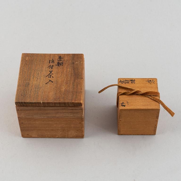 A group of two blue and white jars, one Korean, 19th century, the other Sawankalok, 13-14th century.