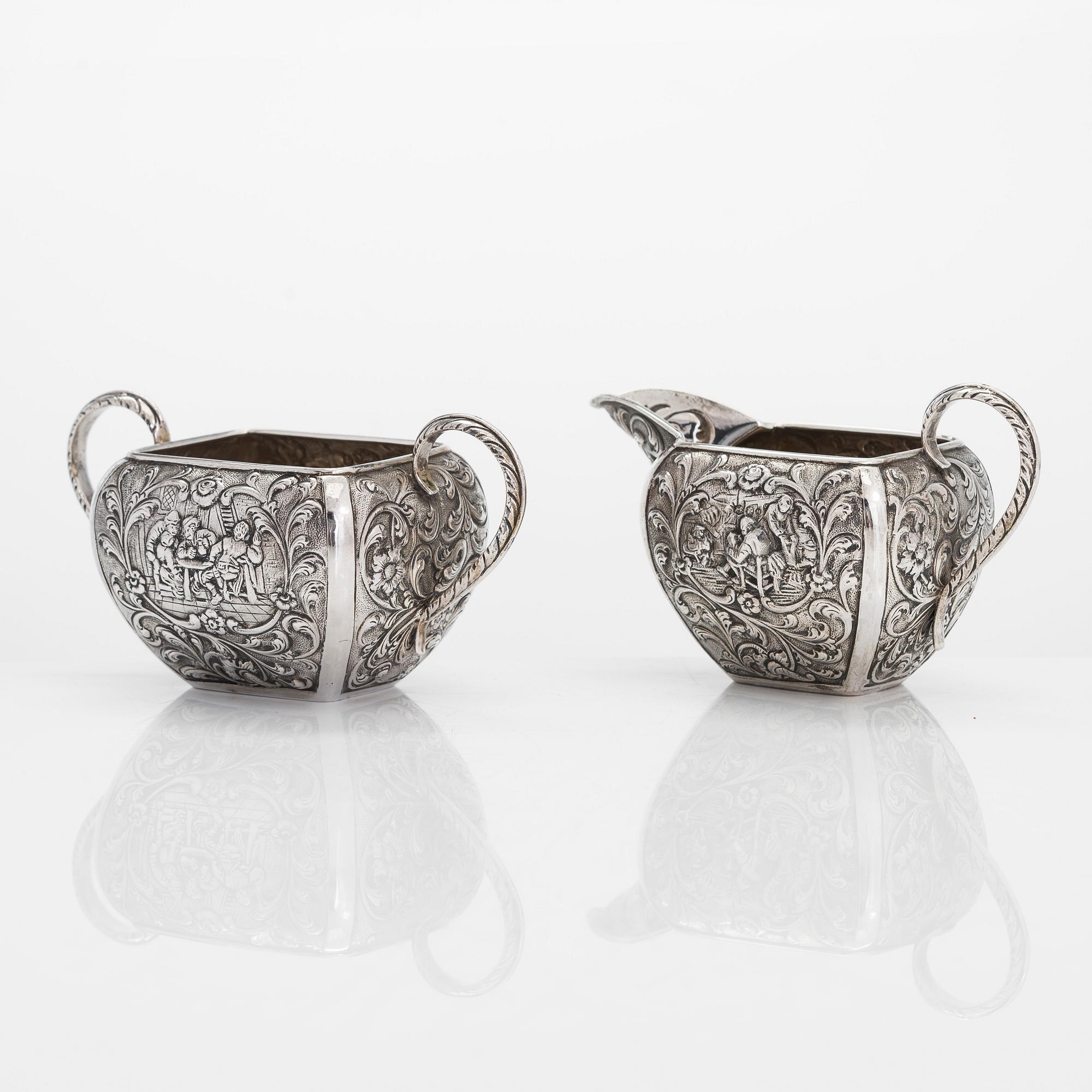 A 1940s Dutch silver sugar bowl and cream jug on a tray, Amsterdam, 1947 and 1942.