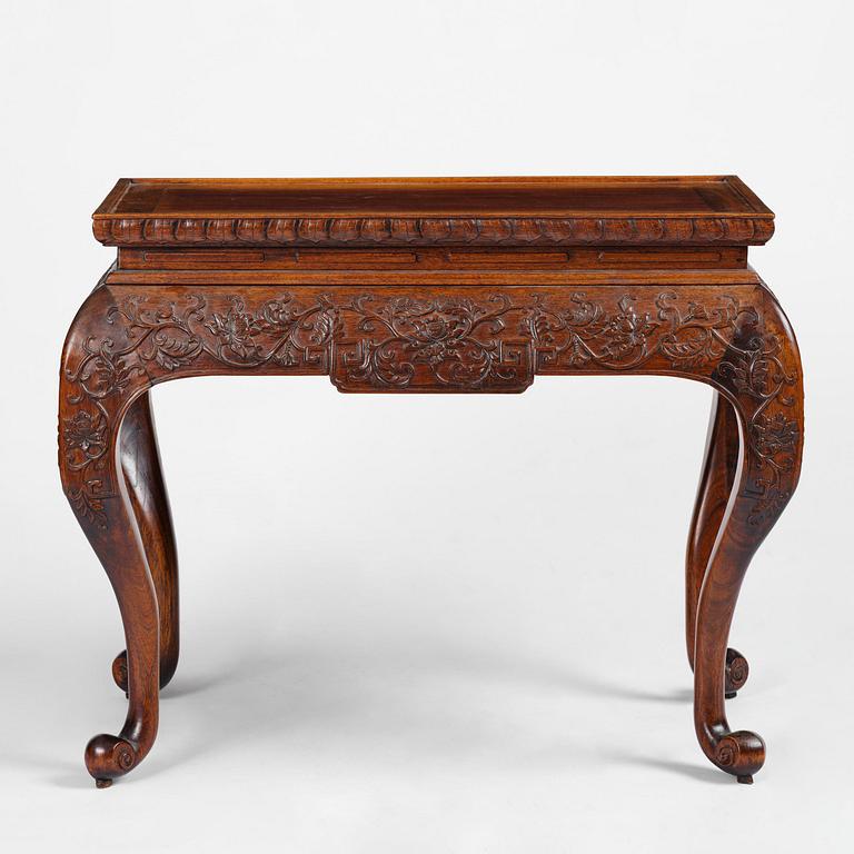 A Chinese waisted huanghuali table, late Qing dynasty/Republic.
