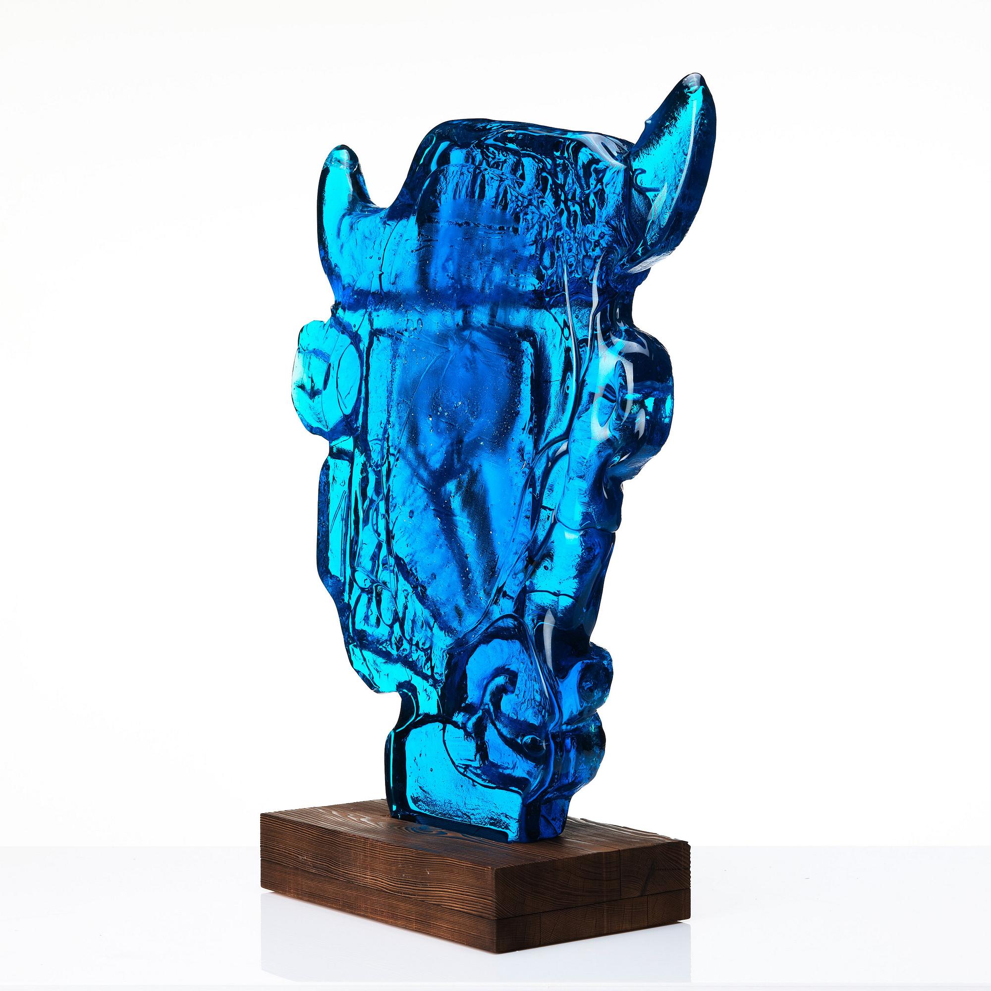 Edvin Öhrström, a blue/ turquoise coloured cast glass sculpture of a bull's head, Lindshammar glassworks, Sweden, signed and dated 1953.