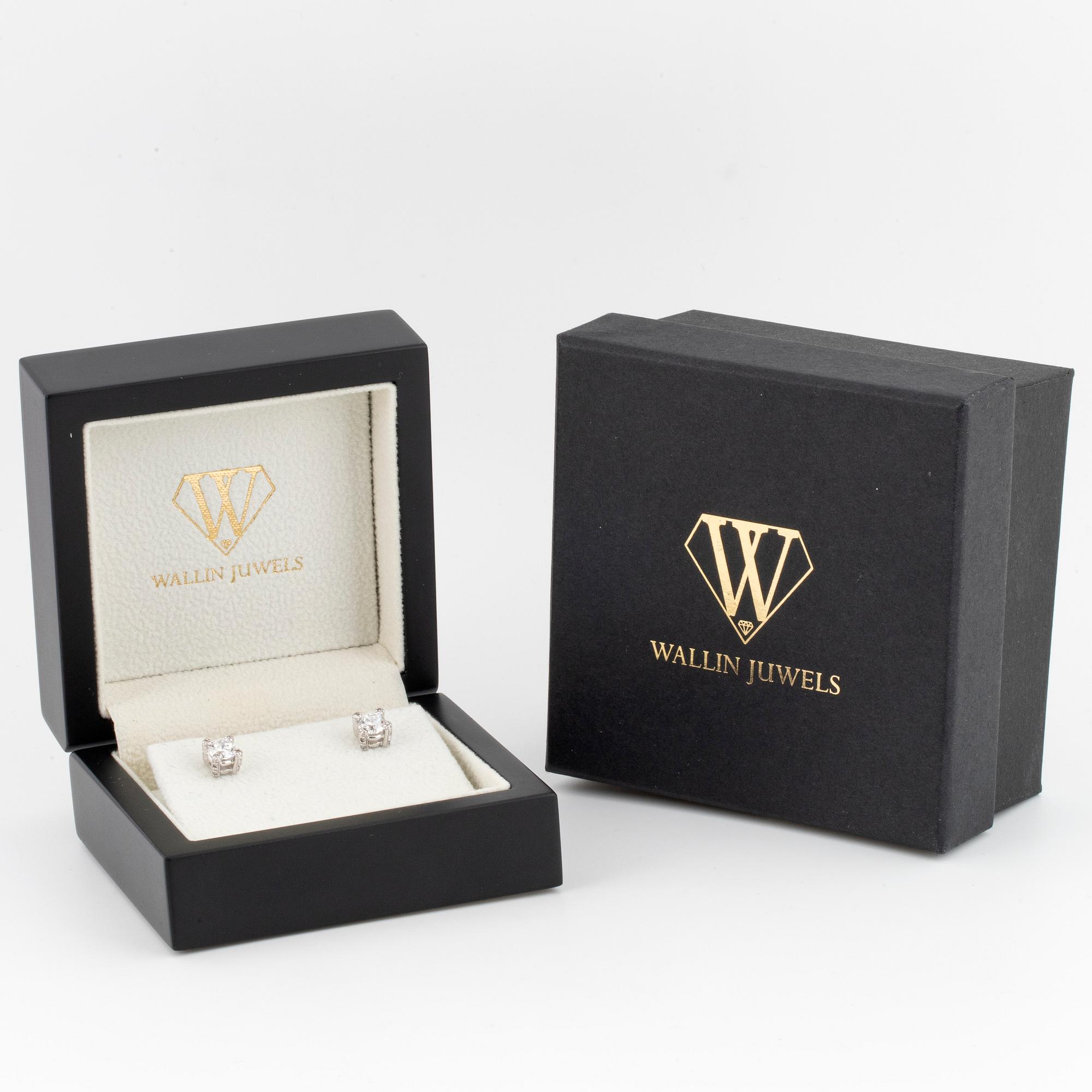 Brilliant-cut diamond stud earrings.
