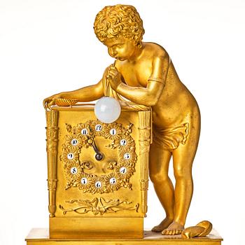 A Empire early 19th century gilt bronze " The Bubble Blower" mantel clock.