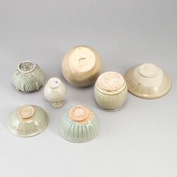 A group of seven pale olive green South East Asian ceramics, songstyle, 20th Century.