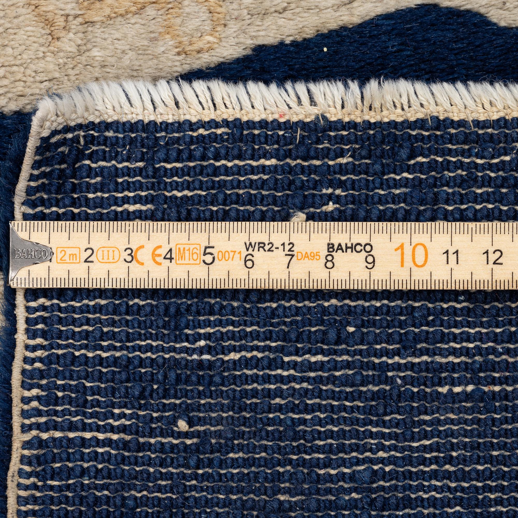 A Chinese 'immortals' carpet, Baotou, Measure: approx. 75 x 185 cm.